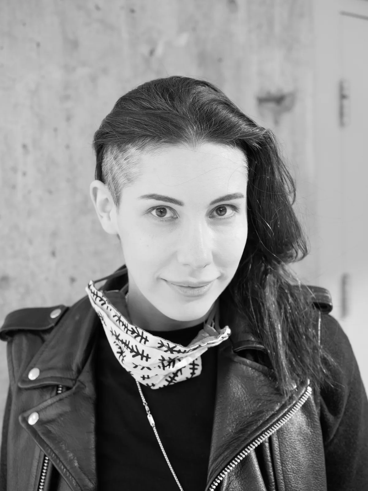 Black-and-white portrait of Kat Singer.